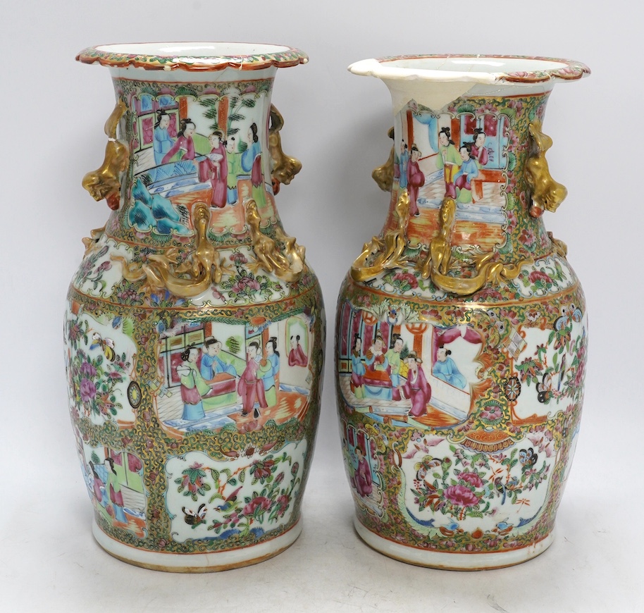 A pair of 19th century Chinese Canton famille rose vases, 36cm high. Condition - poor